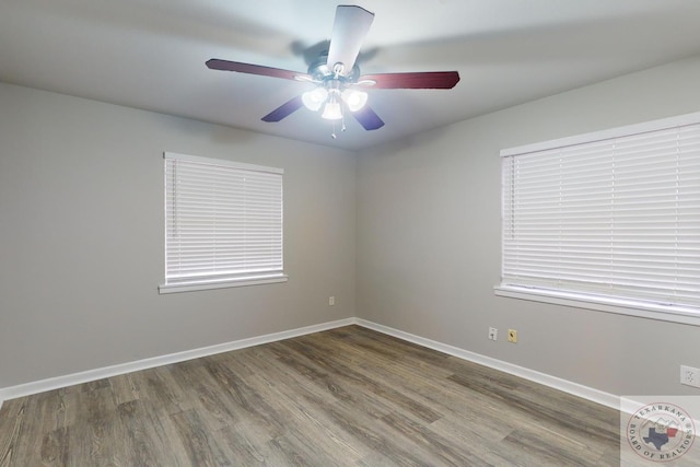 unfurnished room with hardwood / wood-style floors and ceiling fan