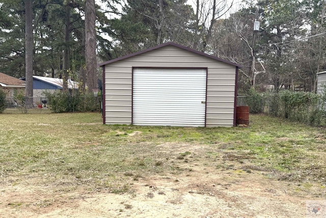 garage featuring a lawn