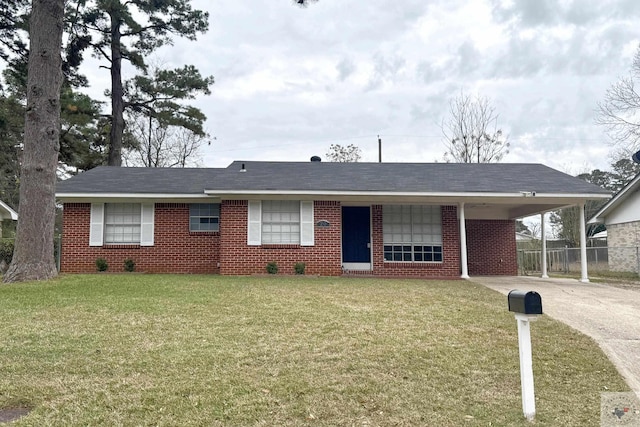 ranch-style home with a carport and a front lawn