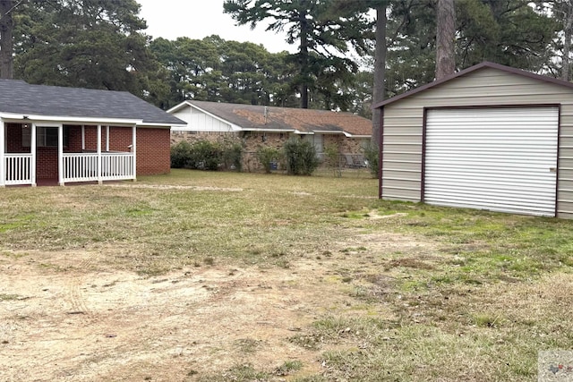 view of yard with an outdoor structure and a garage