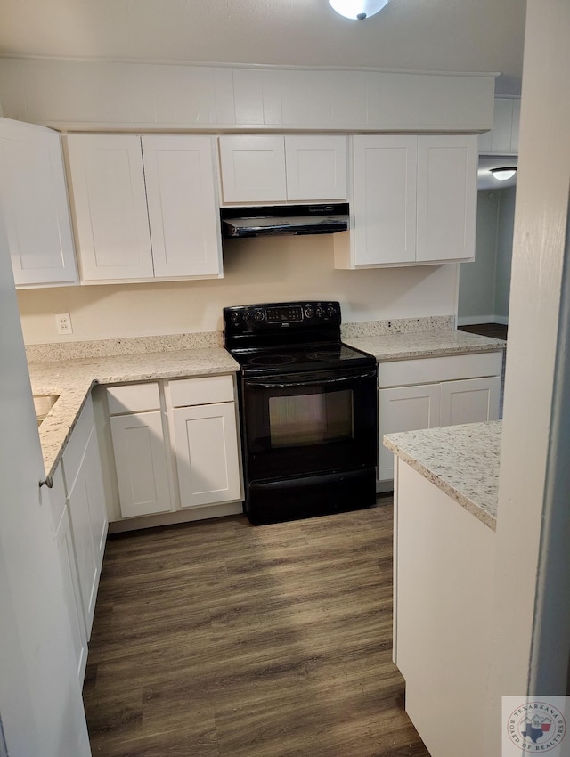 kitchen featuring black range with electric stovetop, white cabinets, and dark hardwood / wood-style flooring