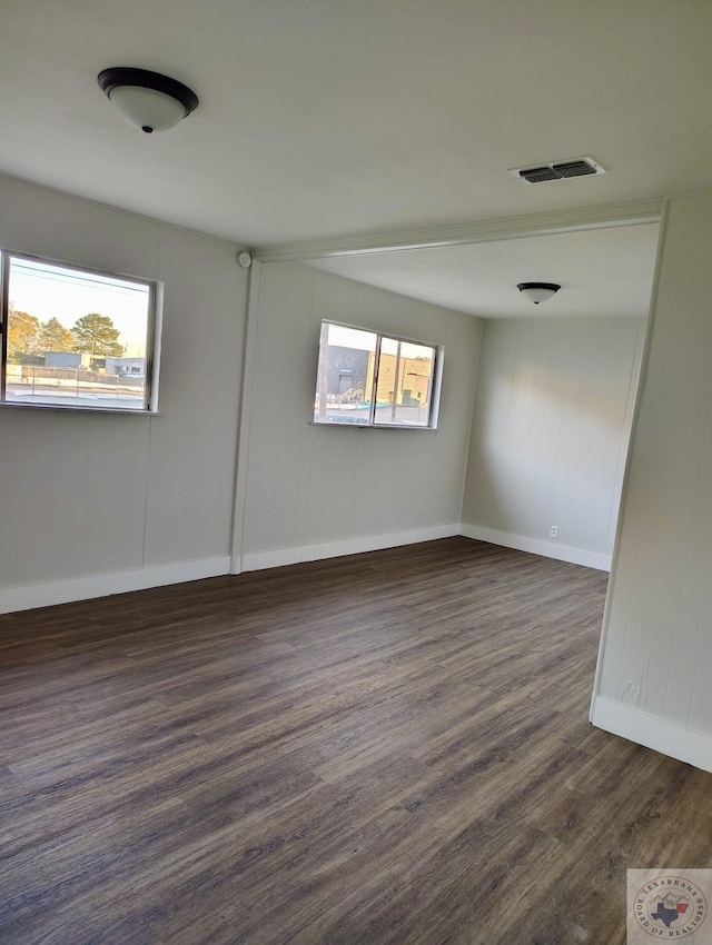 spare room featuring dark hardwood / wood-style flooring