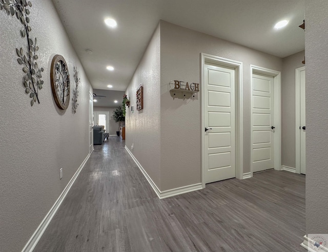 hall with wood-type flooring