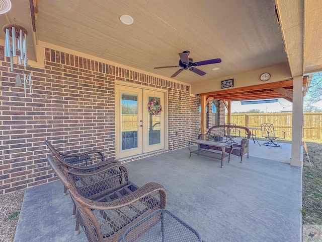 view of patio with french doors and ceiling fan