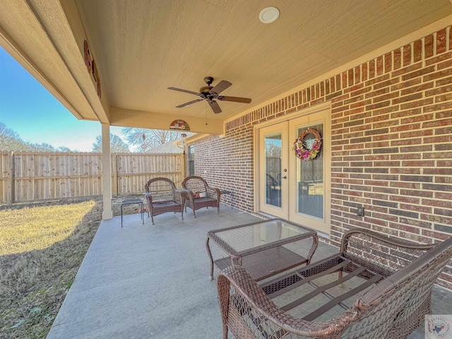 view of patio featuring ceiling fan and french doors