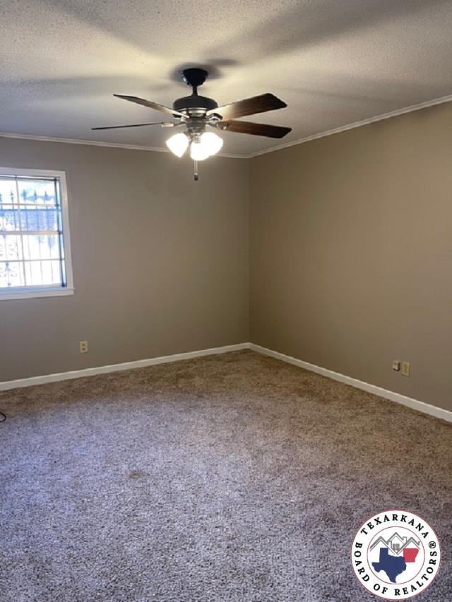 500 Wade Ln, Texarkana, TX 75501 - unfurnished room featuring ceiling fan, ornamental molding, a textured ceiling, carpet flooring, and baseboards