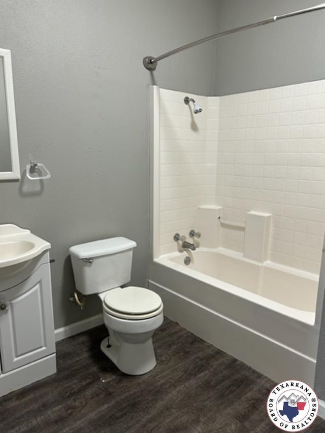 500 Wade Ln, Texarkana, TX 75501 - full bathroom featuring wood finished floors, toilet, vanity, and shower / bath combination