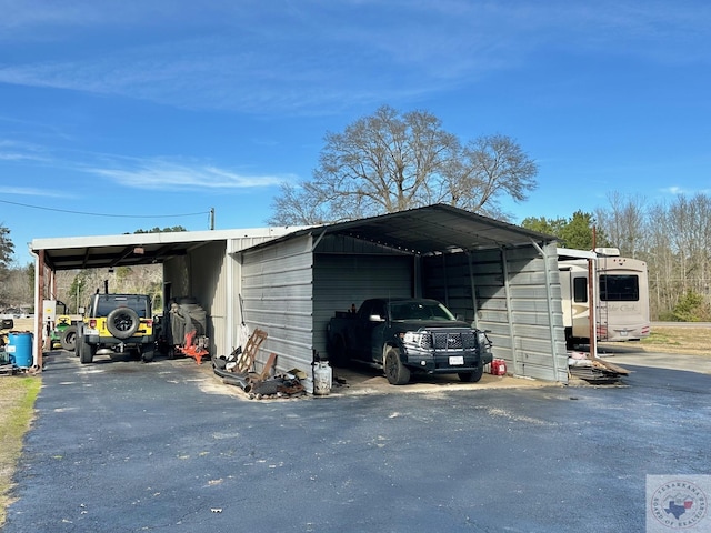 view of outbuilding with a carport