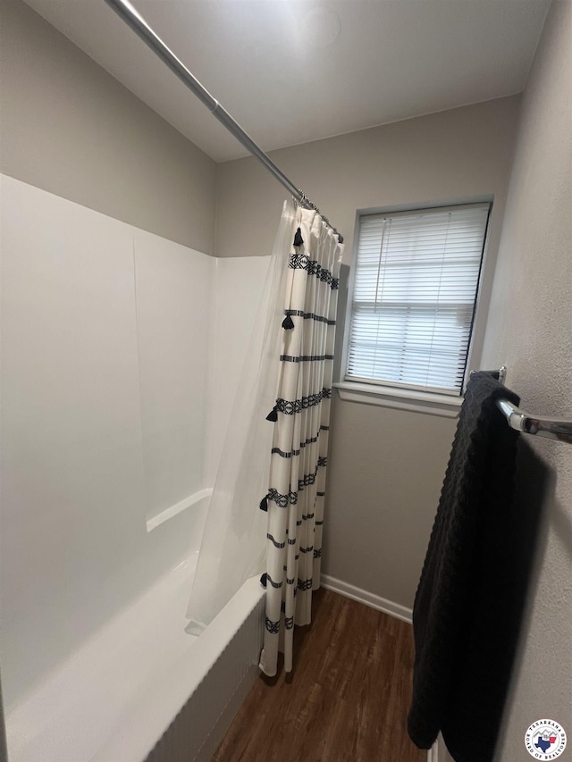 4801 Sanderson Ln, Texarkana, AR 71854 - full bathroom with wood finished floors and shower / bathtub combination with curtain