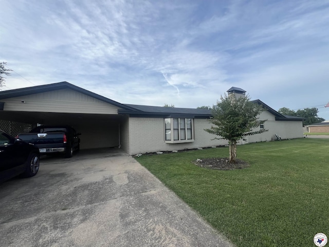 4801 Sanderson Ln, Texarkana, AR 71854 - ranch-style house featuring concrete driveway, a carport, brick siding, and a front lawn