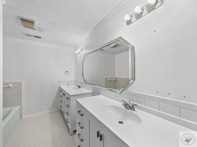 bathroom with tile patterned floors, ornamental molding, a textured ceiling, vanity, and decorative backsplash