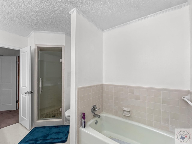 bathroom with a textured ceiling, toilet, tile walls, and shower with separate bathtub