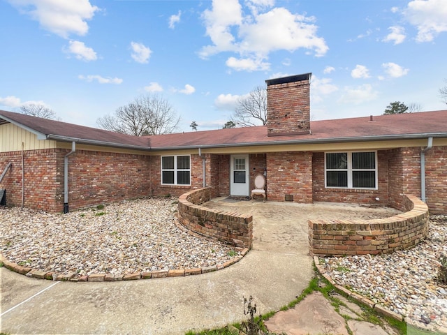 rear view of property with a patio area