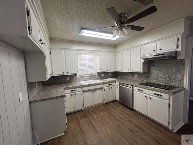 kitchen featuring dark wood-type flooring, under cabinet range hood, dishwasher, black electric cooktop, and a sink