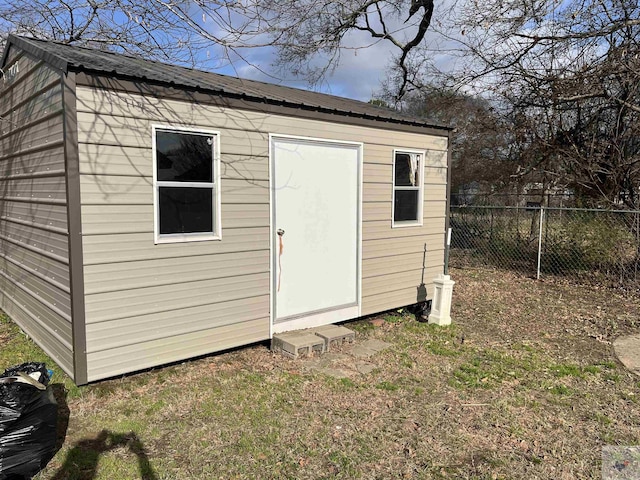 view of shed with fence