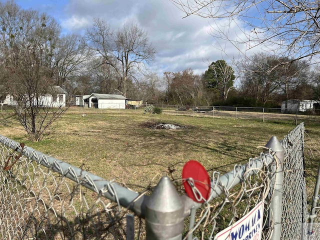 view of yard featuring fence and a rural view