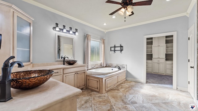 588 B K Pickering Dr, Texarkana, TX 75501 - bathroom featuring crown molding, a ceiling fan, a bath, baseboards, and a spacious closet