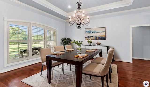 588 B K Pickering Dr, Texarkana, TX 75501 - dining room featuring a chandelier, a raised ceiling, wood finished floors, baseboards, and crown molding