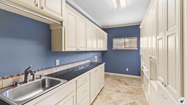 588 B K Pickering Dr, Texarkana, TX 75501 - laundry area with cabinet space, hookup for a washing machine, ornamental molding, and baseboards