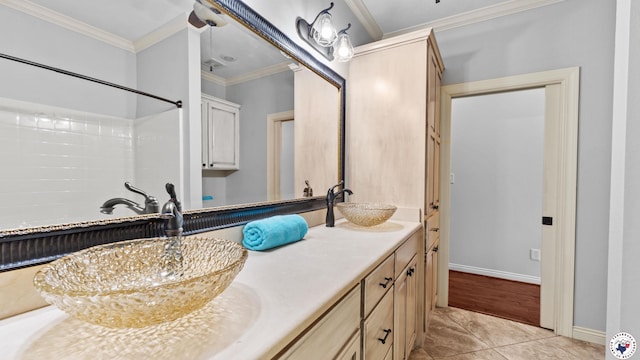 588 B K Pickering Dr, Texarkana, TX 75501 - bathroom featuring double vanity, crown molding, tile patterned floors, and baseboards