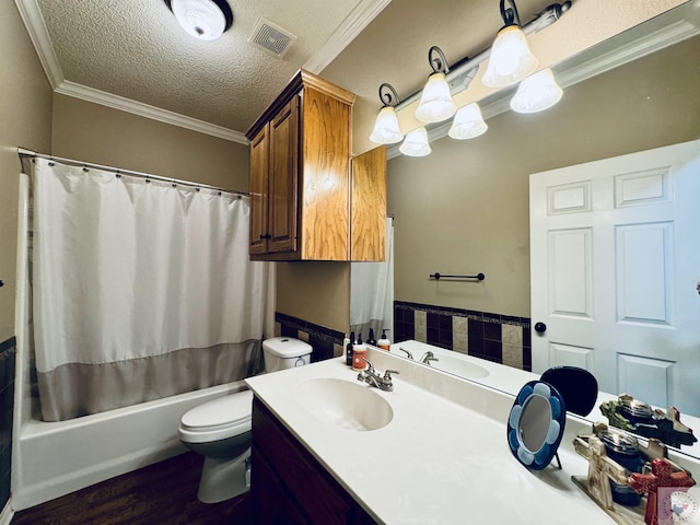 full bathroom with crown molding, toilet, a textured ceiling, and shower / bathtub combination with curtain