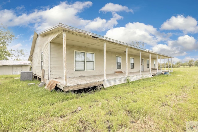 9411 S Fm 137, Paris, TX 75418 - rear view of house featuring a lawn and cooling unit