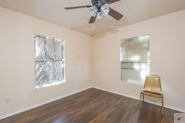 9411 S Fm 137, Paris, TX 75418 - empty room with dark wood-type flooring, a ceiling fan, and baseboards
