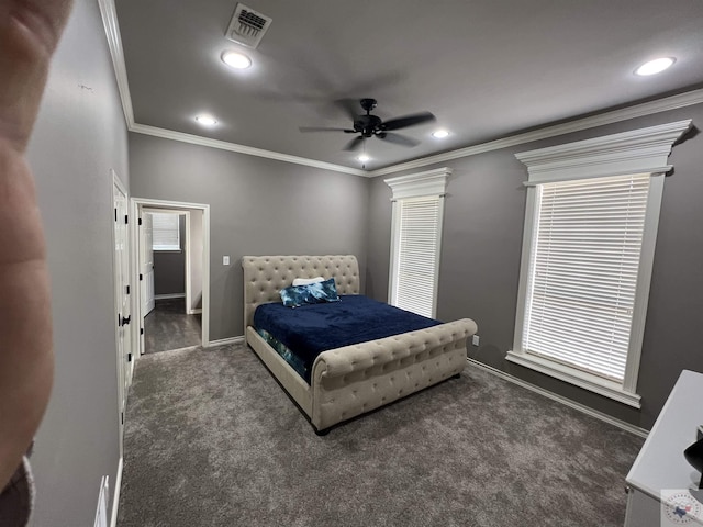 carpeted bedroom with crown molding and ceiling fan