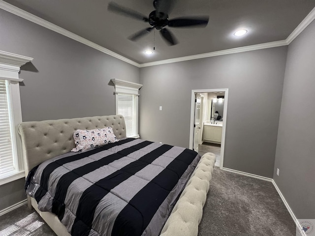 carpeted bedroom featuring ensuite bath, ceiling fan, and ornamental molding