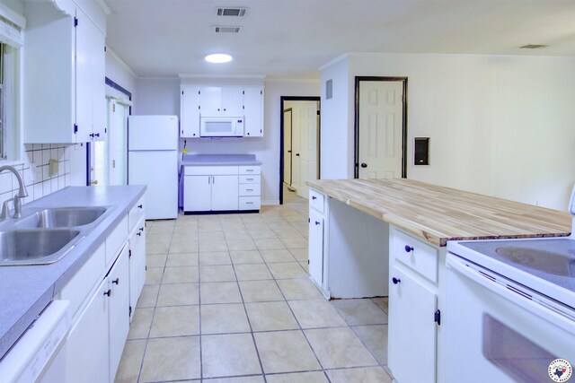 417 Carroll Ave, Wake Village, TX 75501 - kitchen featuring white appliances, tasteful backsplash, white cabinets, light countertops, and ornamental molding