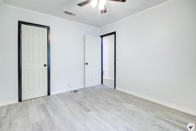 417 Carroll Ave, Wake Village, TX 75501 - unfurnished bedroom featuring crown molding, wood finished floors, and ceiling fan