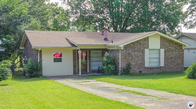 417 Carroll Ave, Wake Village, TX 75501 - ranch-style house with brick siding, a front lawn, and a shingled roof