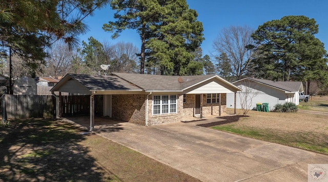 ranch-style home with an attached carport, a front yard, fence, driveway, and stone siding