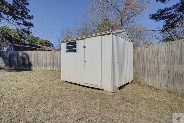 view of shed featuring a fenced backyard