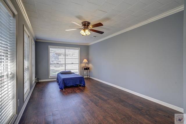 unfurnished room with ceiling fan, baseboards, wood finished floors, and ornamental molding