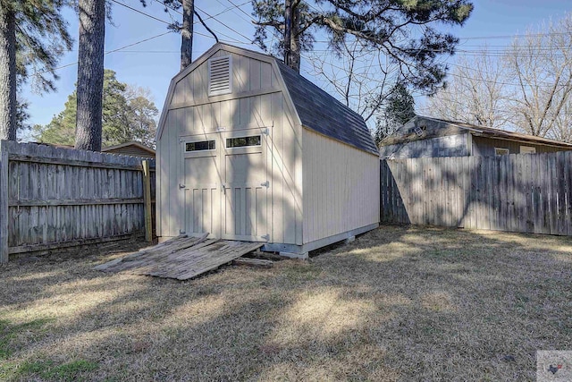 view of shed with a fenced backyard