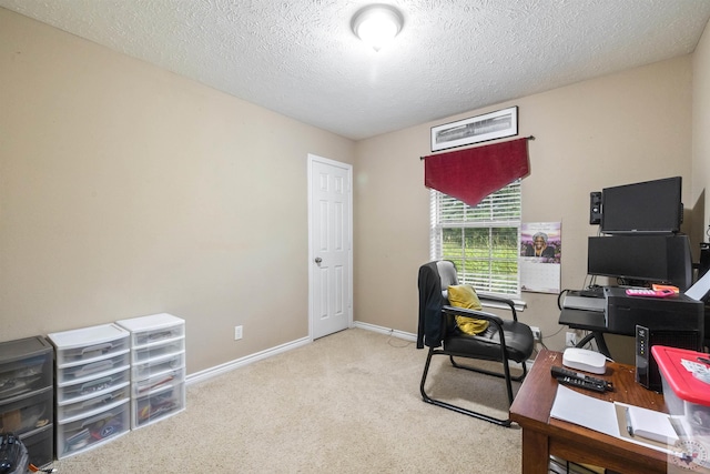 office space featuring light colored carpet and a textured ceiling