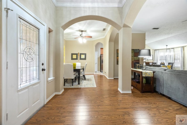 entryway featuring crown molding, hardwood / wood-style flooring, and ceiling fan