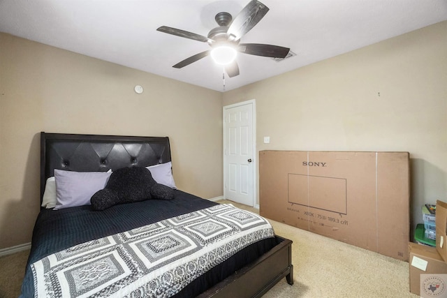 bedroom with ceiling fan and carpet flooring