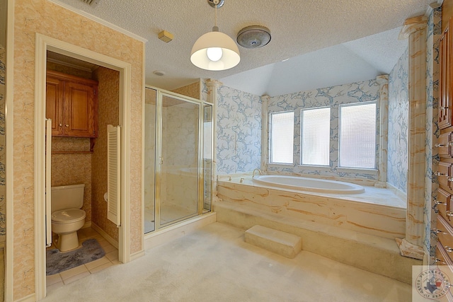 bathroom with a textured ceiling, toilet, and shower with separate bathtub