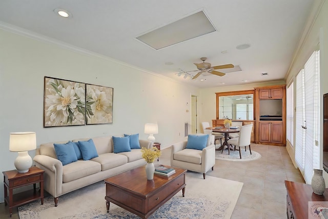 living room with crown molding and ceiling fan