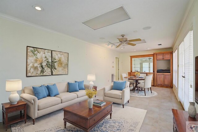 living room with crown molding and ceiling fan