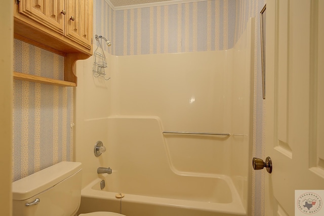 bathroom with toilet and  shower combination