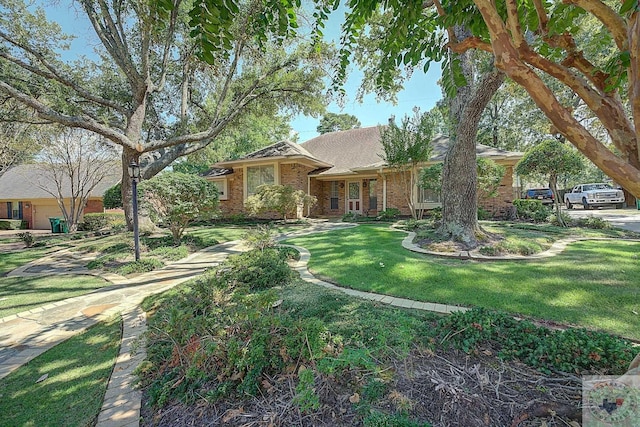 single story home with a front yard