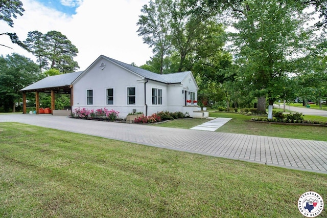 3302 Olive St, Texarkana, TX 75503 - view of front of home featuring stucco siding and a front yard