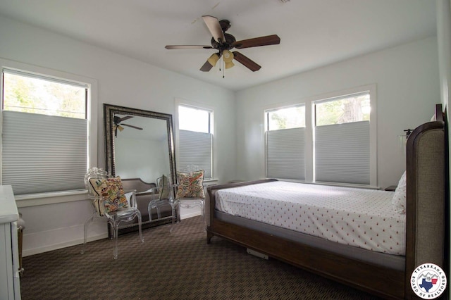 3302 Olive St, Texarkana, TX 75503 - carpeted bedroom with a ceiling fan and baseboards