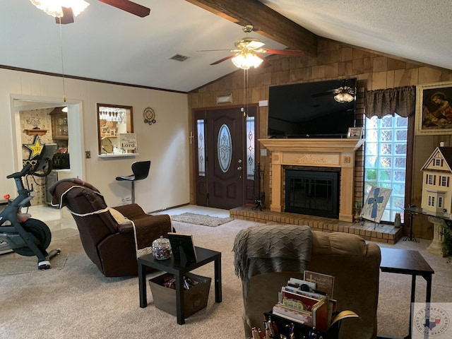 living room featuring a brick fireplace, lofted ceiling with beams, ceiling fan, and carpet