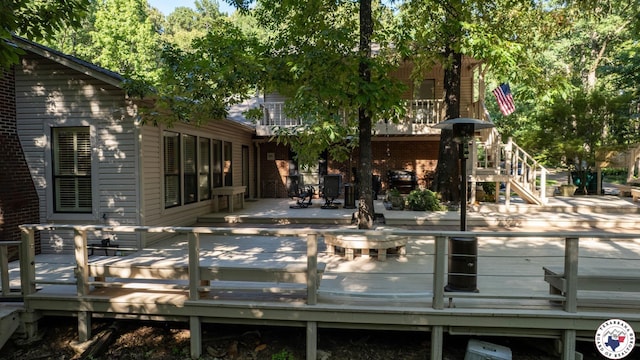 6 High Point Dr, Texarkana, TX 75503 - rear view of house featuring stairway, brick siding, and a wooden deck