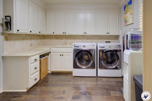 6 High Point Dr, Texarkana, TX 75503 - washroom with separate washer and dryer, cabinet space, and dark wood-style flooring