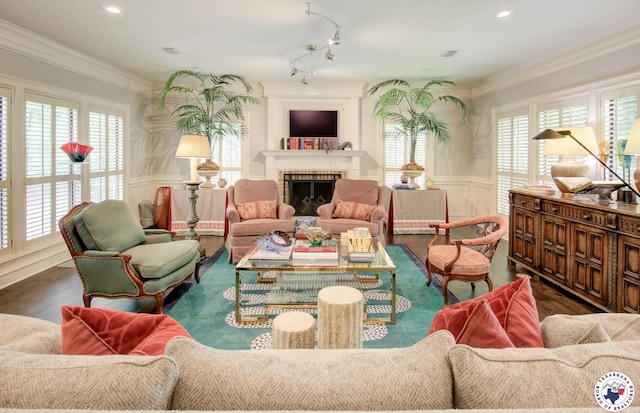6 High Point Dr, Texarkana, TX 75503 - living area with wainscoting, crown molding, wood finished floors, a brick fireplace, and a decorative wall